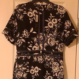 Black dress with white floral detail